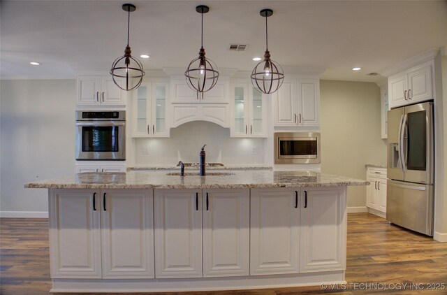 5512 S Columbia Ct, Tulsa, OK 74105 - kitchen with appliances with stainless steel finishes, white cabinets, backsplash, dark wood-type flooring, and light stone countertops