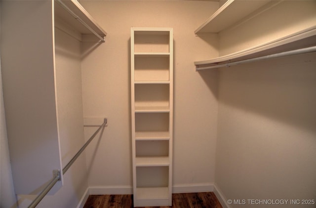 5512 S Columbia Ct, Tulsa, OK 74105 - spacious closet featuring dark wood-style flooring