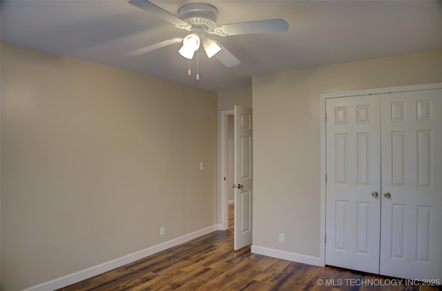 5512 S Columbia Ct, Tulsa, OK 74105 - unfurnished bedroom featuring a closet, dark wood-style floors, and a ceiling fan