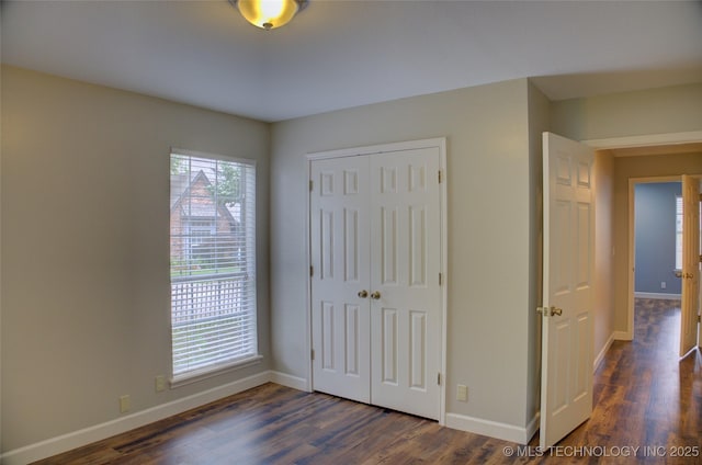 5512 S Columbia Ct, Tulsa, OK 74105 - unfurnished bedroom featuring wood finished floors and a closet