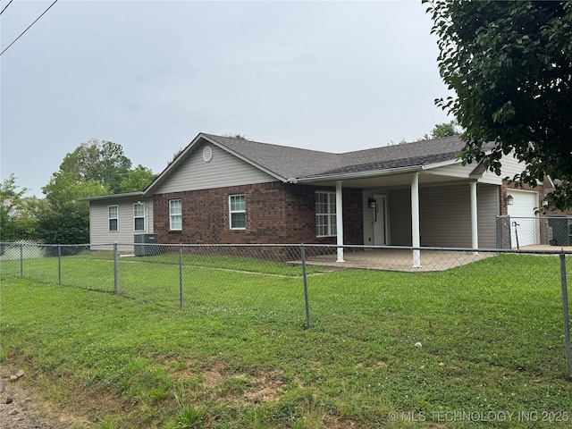 1122 Green St, Sallisaw, OK 74955 - back of house with a garage, brick siding, and a patio area