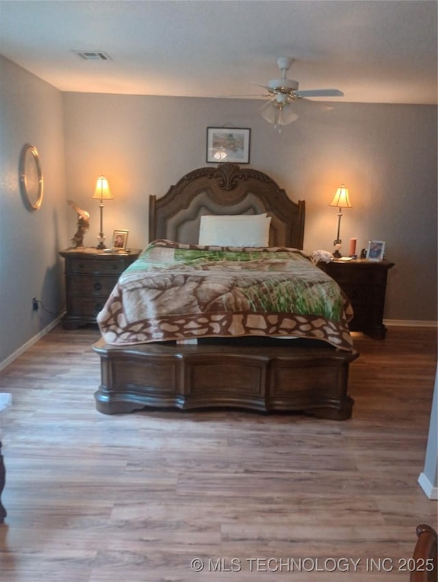 1122 Green St, Sallisaw, OK 74955 - bedroom featuring wood finished floors and ceiling fan