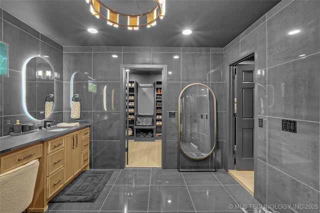 2227 E 26th Pl, Tulsa, OK 74114 - full bathroom with tile walls, tile patterned floors, and vanity