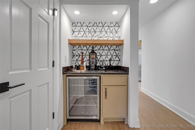 2227 E 26th Pl, Tulsa, OK 74114 - indoor wet bar featuring wine cooler, light wood finished floors, and recessed lighting