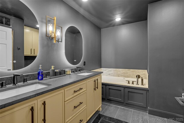 2227 E 26th Pl, Tulsa, OK 74114 - full bathroom featuring double vanity, a bath, and recessed lighting