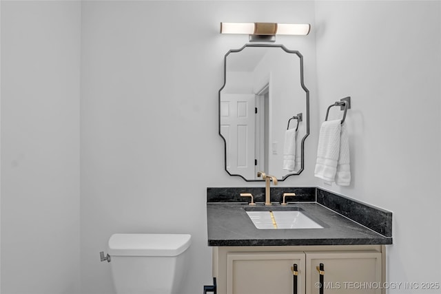 2227 E 26th Pl, Tulsa, OK 74114 - half bathroom with vanity and toilet