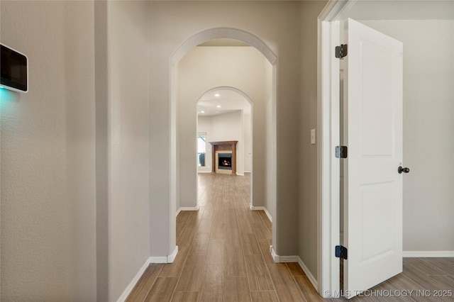 1908 E 133rd Ct, Bixby, OK 74008 - hall featuring wood finished floors, arched walkways, and recessed lighting