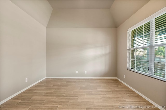 1908 E 133rd Ct, Bixby, OK 74008 - spare room featuring light wood-style floors and vaulted ceiling