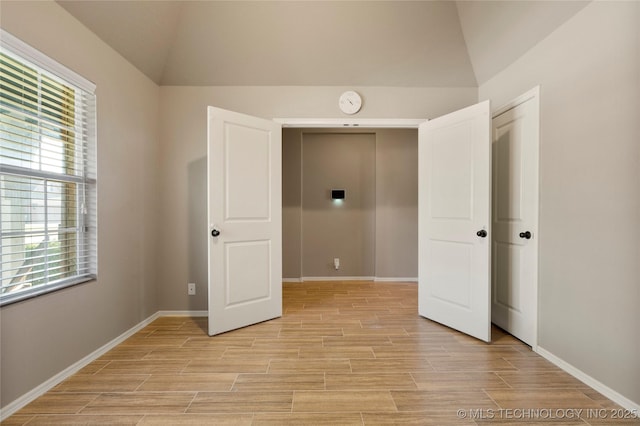1908 E 133rd Ct, Bixby, OK 74008 - unfurnished bedroom with vaulted ceiling and light wood-type flooring