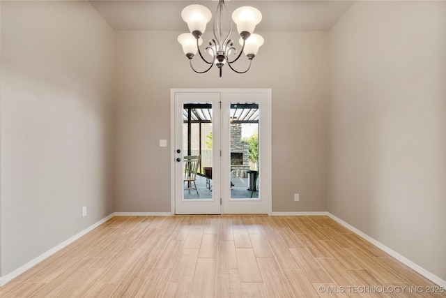 1908 E 133rd Ct, Bixby, OK 74008 - spare room featuring a chandelier and light wood-type flooring