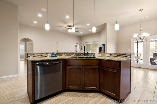 1908 E 133rd Ct, Bixby, OK 74008 - kitchen featuring dishwasher, arched walkways, decorative backsplash, a ceiling fan, and plenty of natural light