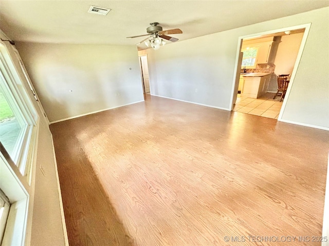 106 E Elk Rd, Whitefield, OK 74472 - empty room with light wood-style floors and a ceiling fan