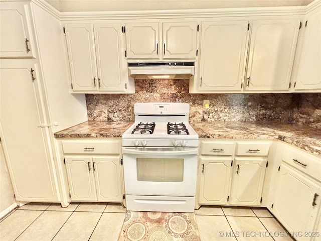 106 E Elk Rd, Whitefield, OK 74472 - kitchen with white range with gas cooktop, under cabinet range hood, light tile patterned flooring, tasteful backsplash, and light countertops