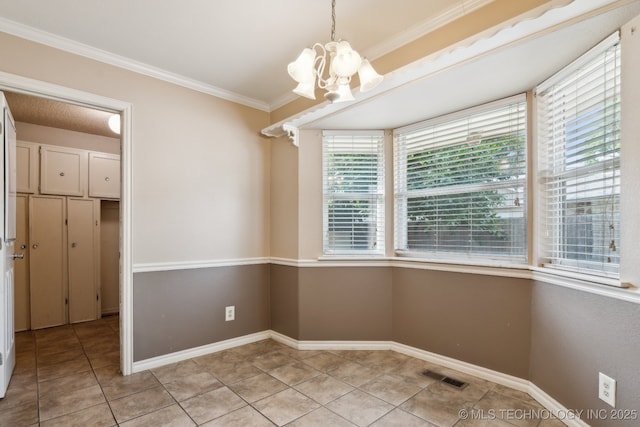 8202 S Ash Pl, Broken Arrow, OK 74011 - unfurnished dining area with light tile patterned floors, a chandelier, and crown molding