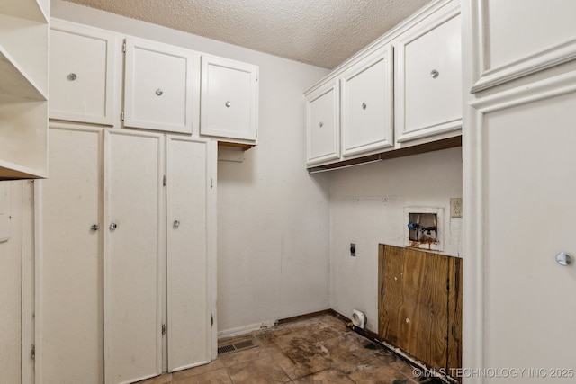 8202 S Ash Pl, Broken Arrow, OK 74011 - laundry room with hookup for an electric dryer, cabinet space, washer hookup, and a textured ceiling