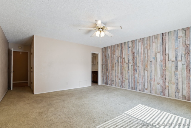 8202 S Ash Pl, Broken Arrow, OK 74011 - empty room with a ceiling fan, carpet, and a textured ceiling