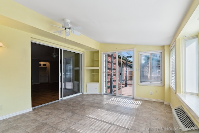 8202 S Ash Pl, Broken Arrow, OK 74011 - unfurnished sunroom featuring a ceiling fan