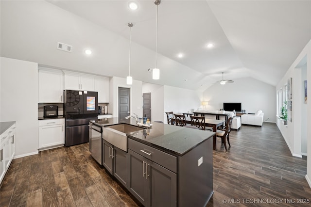 3117 W Winston St, Broken Arrow, OK 74011 - kitchen featuring appliances with stainless steel finishes, vaulted ceiling, ceiling fan, dark wood-type flooring, and white cabinets