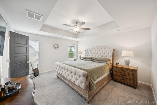 3117 W Winston St, Broken Arrow, OK 74011 - bedroom featuring a raised ceiling, light carpet, and a ceiling fan