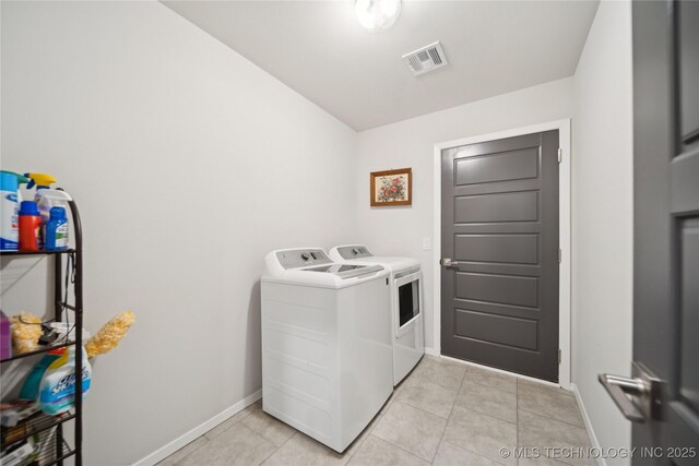 3117 W Winston St, Broken Arrow, OK 74011 - washroom with washer and clothes dryer and light tile patterned floors