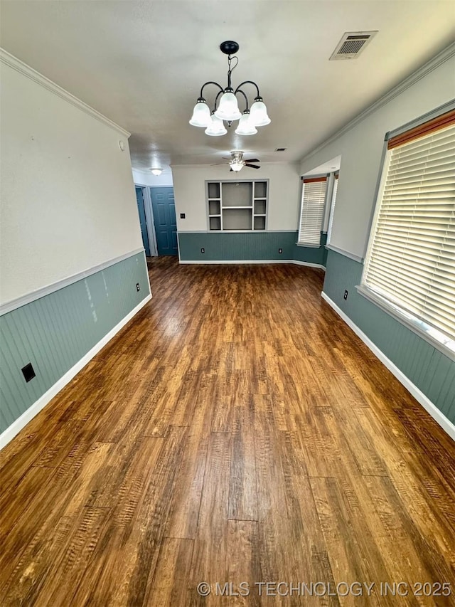 5101 S Spruce Dr, Sand Springs, OK 74063 - unfurnished room with a chandelier, wood finished floors, ornamental molding, a ceiling fan, and built in shelves