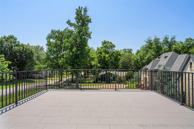 3207 E 44th St, Tulsa, OK 74105 - view of patio / terrace with driveway and view of wooded area