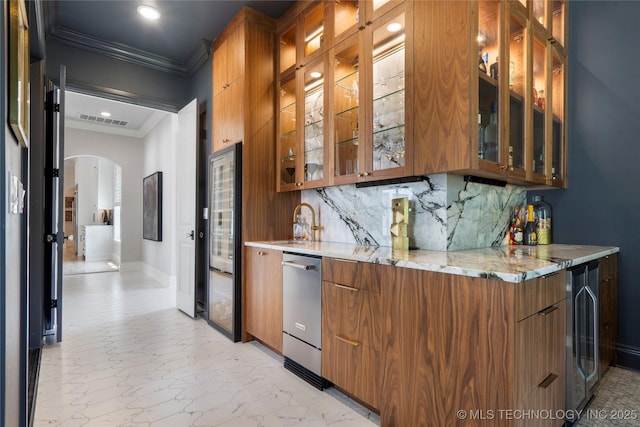 3207 E 44th St, Tulsa, OK 74105 - indoor wet bar featuring crown molding, dishwasher, arched walkways, tasteful backsplash, and beverage cooler