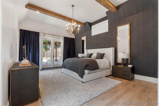 3207 E 44th St, Tulsa, OK 74105 - bedroom featuring access to outside, french doors, wallpapered walls, wood finished floors, and a chandelier
