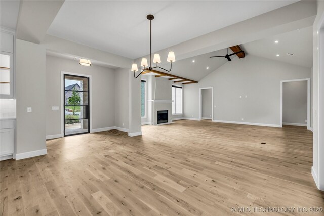 6364 N Blue Sage Dr, Owasso, OK 74055 - unfurnished living room featuring light wood-style flooring, ceiling fan, a fireplace, recessed lighting, and a chandelier