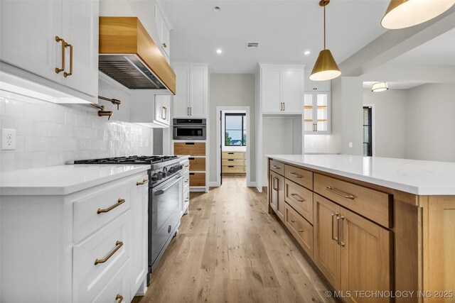6364 N Blue Sage Dr, Owasso, OK 74055 - kitchen featuring gas stove, custom exhaust hood, light wood-type flooring, tasteful backsplash, and oven