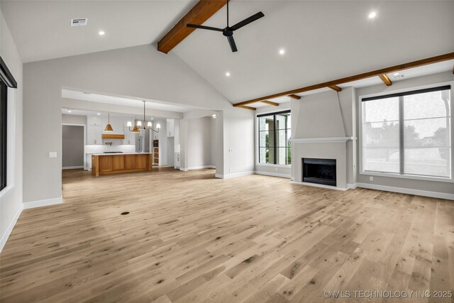 6364 N Blue Sage Dr, Owasso, OK 74055 - unfurnished living room featuring beam ceiling, a ceiling fan, a chandelier, a large fireplace, and recessed lighting