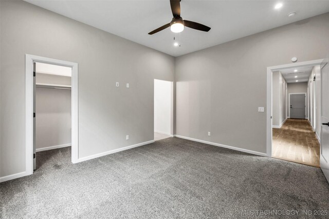 6364 N Blue Sage Dr, Owasso, OK 74055 - unfurnished bedroom with carpet, a walk in closet, recessed lighting, and ceiling fan