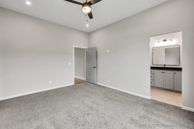 6364 N Blue Sage Dr, Owasso, OK 74055 - unfurnished bedroom featuring light colored carpet, recessed lighting, ensuite bathroom, and a ceiling fan