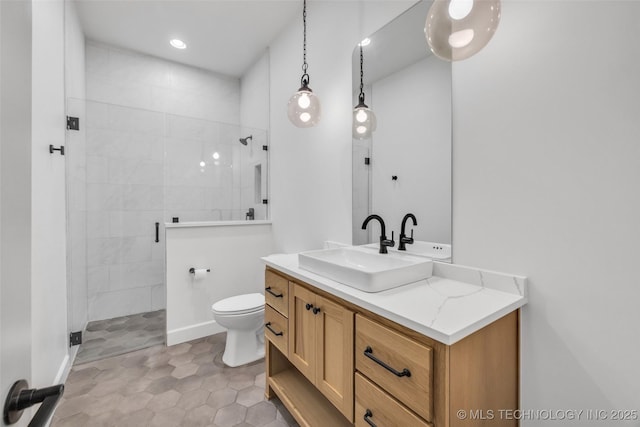 6364 N Blue Sage Dr, Owasso, OK 74055 - bathroom with vanity, a tile shower, and recessed lighting