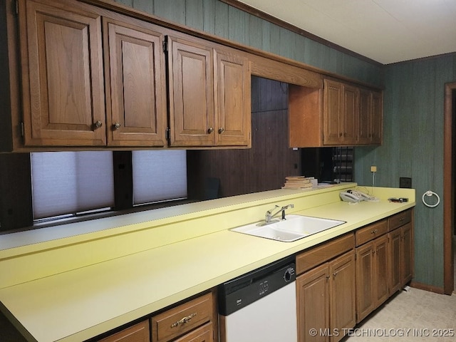1296 Robin Hood Rd, Eufaula, OK 74432 - kitchen with dishwasher, light countertops, and brown cabinetry