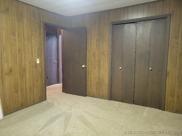 1296 Robin Hood Rd, Eufaula, OK 74432 - unfurnished bedroom with carpet, wooden walls, and a closet