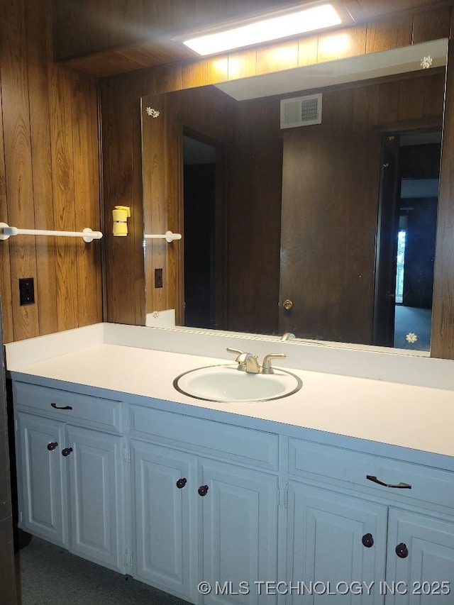 1296 Robin Hood Rd, Eufaula, OK 74432 - bathroom featuring wood walls and vanity