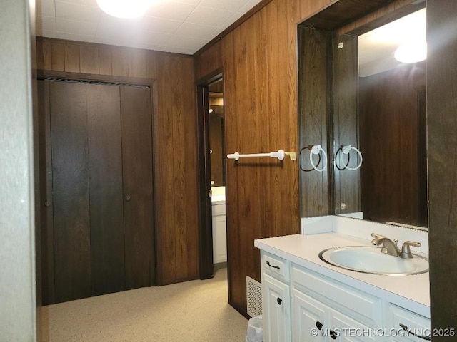 1296 Robin Hood Rd, Eufaula, OK 74432 - bathroom featuring wooden walls, vanity, and a shower