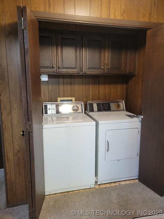 1296 Robin Hood Rd, Eufaula, OK 74432 - washroom featuring cabinet space, washing machine and clothes dryer, and wooden walls