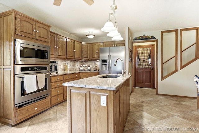 8609 S Joplin Ave, Tulsa, OK 74137 - kitchen with appliances with stainless steel finishes, backsplash, light stone countertops, hanging light fixtures, and brown cabinets