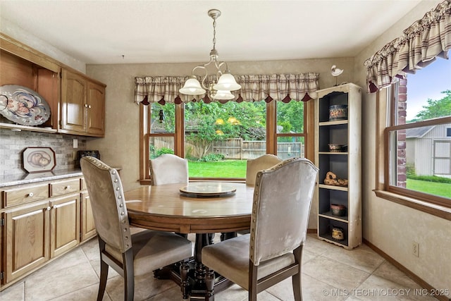 8609 S Joplin Ave, Tulsa, OK 74137 - dining space with light tile patterned flooring and a chandelier