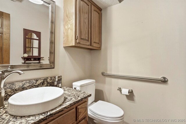 8609 S Joplin Ave, Tulsa, OK 74137 - bathroom with toilet and vanity