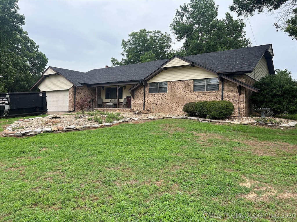 1826 W Mcgill, Eufaula, OK 74432 - ranch-style home with a garage, brick siding, covered porch, and a front lawn