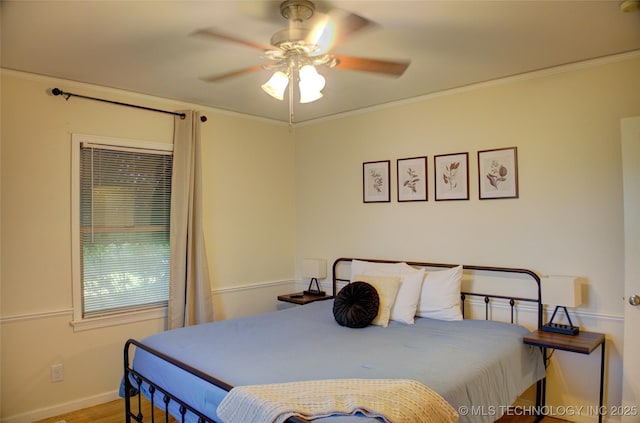 2328 S Delaware Ct, Tulsa, OK 74114 - bedroom with wood finished floors, crown molding, and a ceiling fan