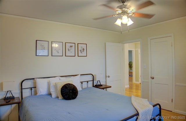 2328 S Delaware Ct, Tulsa, OK 74114 - bedroom with crown molding, light wood-style floors, and ceiling fan