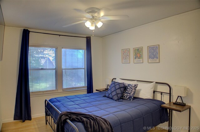 2328 S Delaware Ct, Tulsa, OK 74114 - bedroom featuring light wood-style floors and a ceiling fan