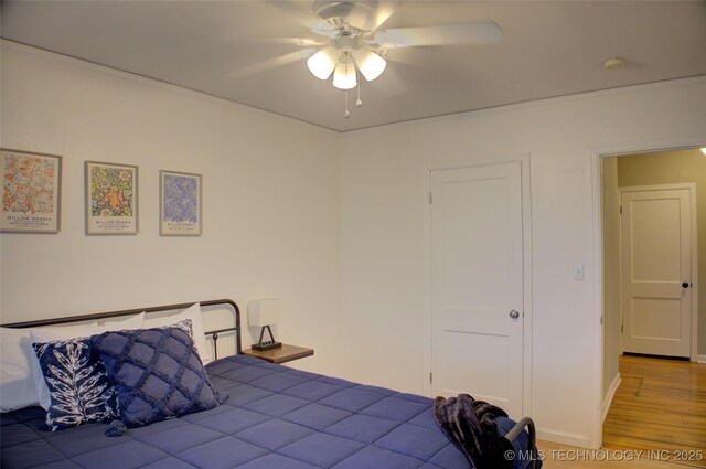 2328 S Delaware Ct, Tulsa, OK 74114 - bedroom featuring wood finished floors and ceiling fan