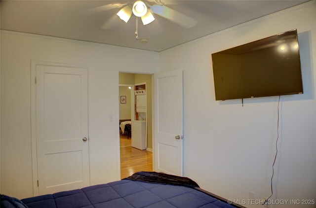 2328 S Delaware Ct, Tulsa, OK 74114 - bedroom with wood finished floors, crown molding, and ceiling fan