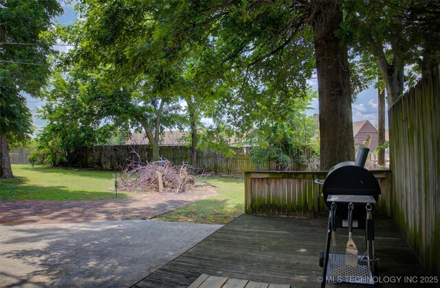 2328 S Delaware Ct, Tulsa, OK 74114 - wooden terrace featuring a fenced backyard and a grill