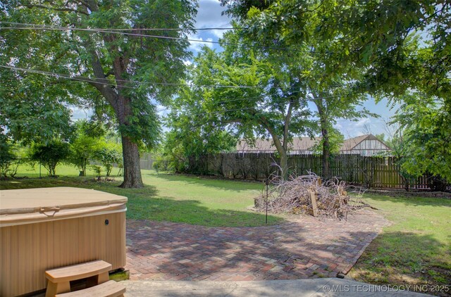 2328 S Delaware Ct, Tulsa, OK 74114 - fenced backyard with a hot tub and a patio